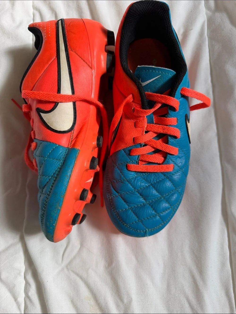 Nike Kids Soccer Cleats in Blue and Bright Orange